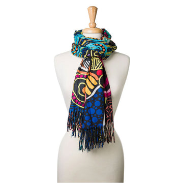 A mannequin is wearing a colourful scarf with artwork by Justin Butler.