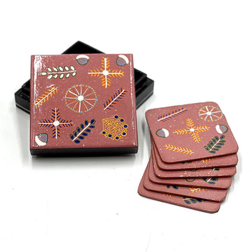 A set of six coasters and a matching box printed with artwork by Rosie Ross in brown.