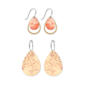 Two pairs of teardrop-shaped earrings with leaf pattern on a white background.
