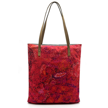 A red tote bag with brown straps and printed with artwork by Andrea Adamson.