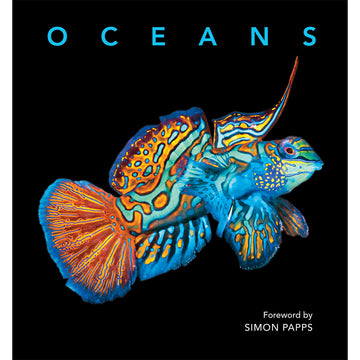 'Oceans' book cover featuring a colourful fish on a black background.