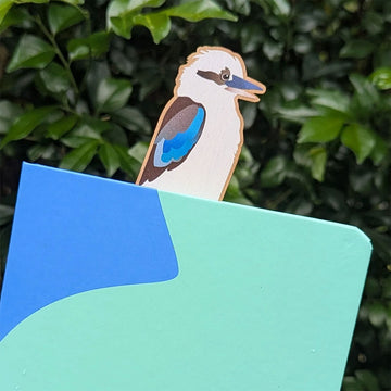 Wooden bookmark with Kookaburra design on a white background.