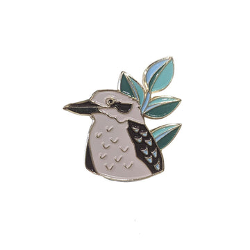 A kookaburra shaped enamel pin on a white background.