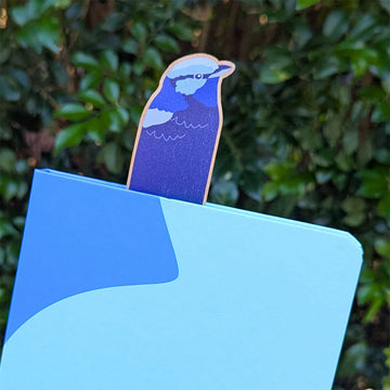 Wooden bookmark with blue wren design attached to packaging on a white background.