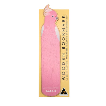 Pink wooden bookmark shaped like a galah bird attached to packaging on a white background.