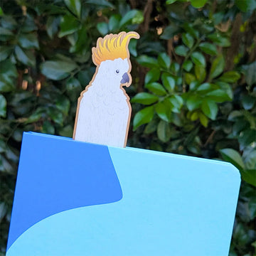 Wooden bookmark with cockatoo design on a white background.