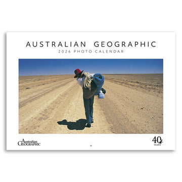 Australian Geographic 2026 Photo Calendar cover with a photo of a person walking in the outback.