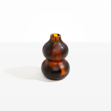 A double bubble shaped vase in tortoise shell resin.