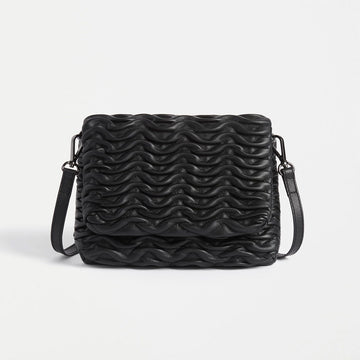 Front view of a rectangle cross body bag with an embossed wave pattern across the bag.
