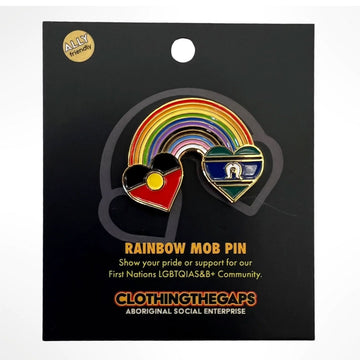 An enamel pin with the Aboriginal flag in a heart on one side and the Torres Strait Islander flag in a heart on the other side. They are connected with a rainbow and attached to a black card.