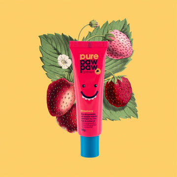 A small pink tube of paw paw ointment with a blue lid and illustration of strawberries behind.