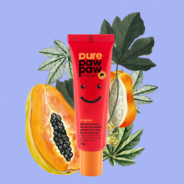 Red tube of pure paw paw ointment with a papaya and leaves on a blue background.