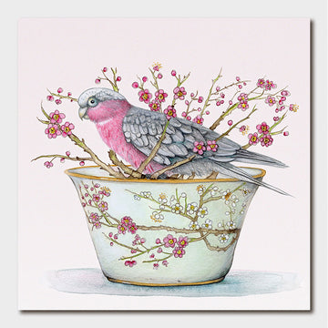 Illustration of a pink and gray bird on a branch with flowers inside a teacup.