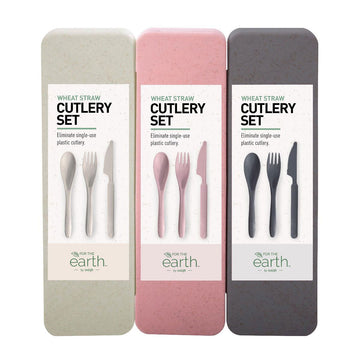Three cutlery set boxes in beige, pink and grey.
