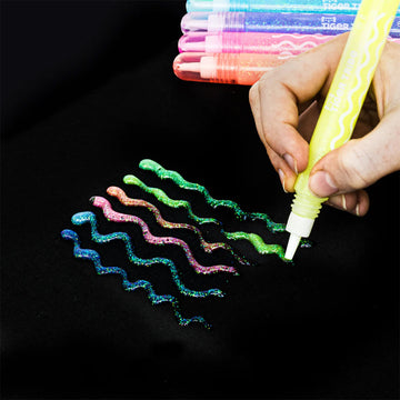 A box with glow pens inside with wavy glow lines on the outside of the box.