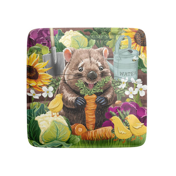 Square magnet with a quokka holding a carrot in a garden setting.