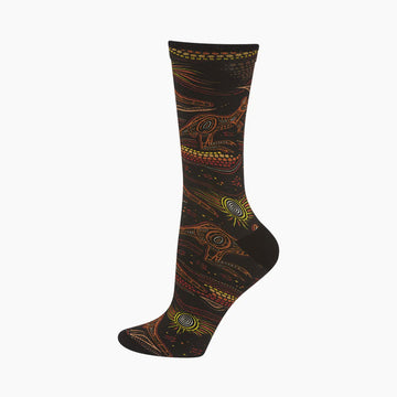 A black sock printed with an Indigenous design of kangaroos and suns.