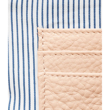 A light pink coin purse with a zip at the top.