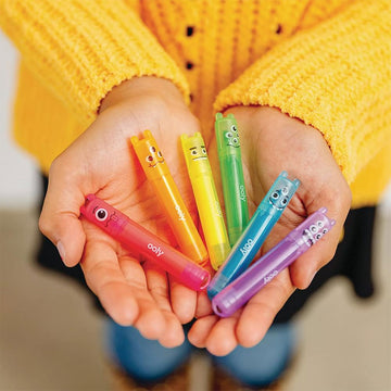 A display of mini coloured highlighters each with a different monster face on them.