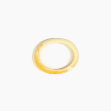 Yellow bangle on a white background.