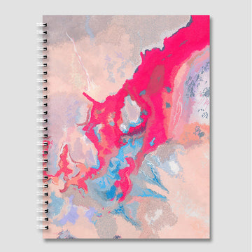 Notebook with a colorful abstract design on a white background.