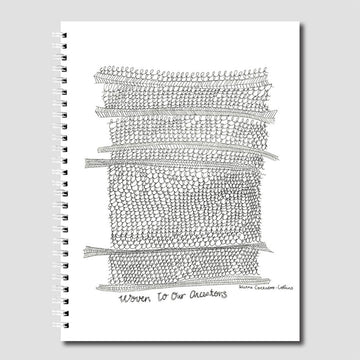 Spiral-bound notebook with black and white woven pattern on a gray background.