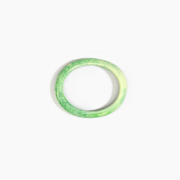 Green bangle on a white background.