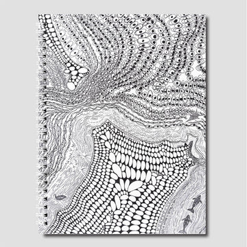 Black and white abstract patterned notebook cover on a gray background.