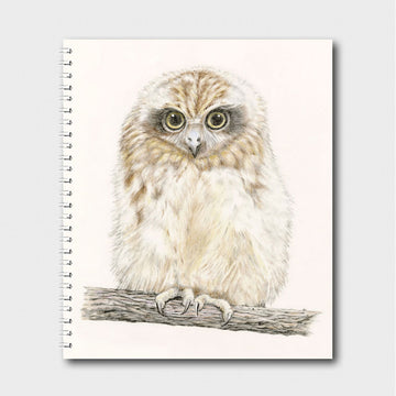 A spiral notebook with an illustration of an owl.