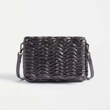 Front view of a rectangle cross body bag with an embossed wave pattern across the bag.