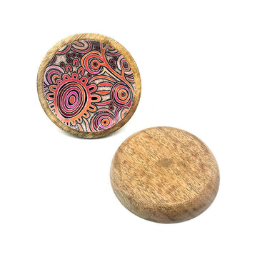 A wooden round trinket dish with a plain back and printed with artwork on the inside.