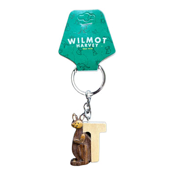 Keychain with wooden kangaroo and letter 'T' charm on a green card with 'Wilmot Harvey' branding.