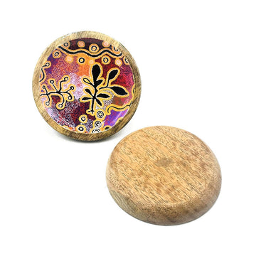 A wooden round trinket dish with a plain back and printed with artwork on the inside.