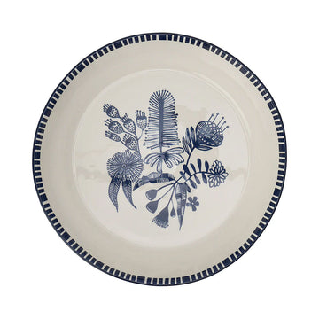 A ceramic bowl illustrated with flowers in blue in the middle.