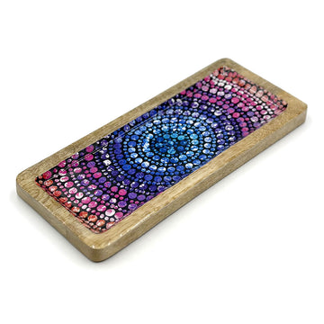 A wooden tray printed with artwork by Olivia Wilson on the inside.