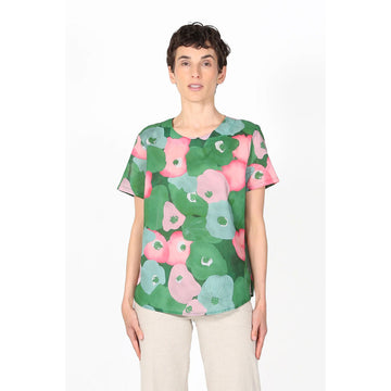 A women's short sleeve top with a pink and green floral print.