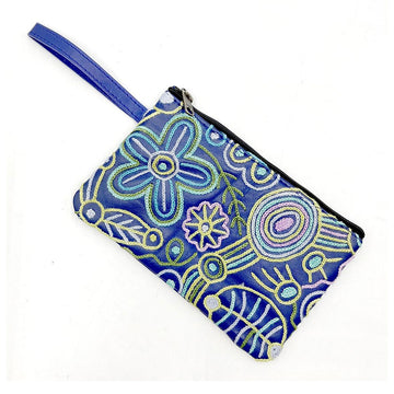A leather coin purse in blue embroidered with artwork by Cedric Varcoe.