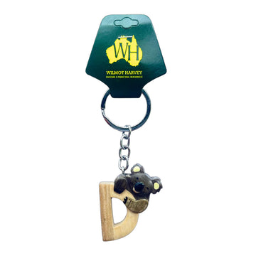Keychain with letter 'D' design and a koala on a Wilmot Harvey branded card.