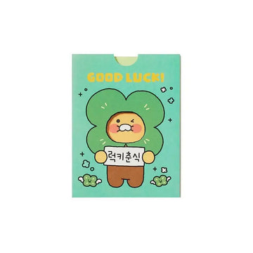 Card with a cartoon character holding a 'Good Luck!' sign on a light green background.