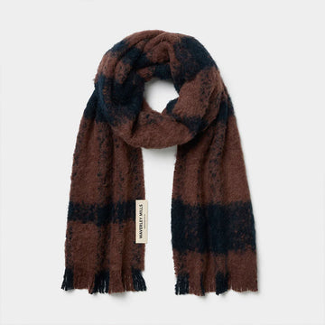Plaid scarf with brown and black pattern on a white background.