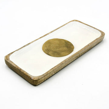 A wooden rectangular tray painted white on the inside with a round gold medallion.