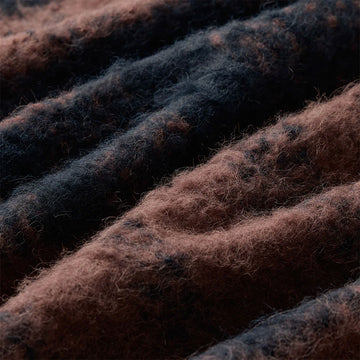 Plaid scarf with brown and black pattern on a white background.
