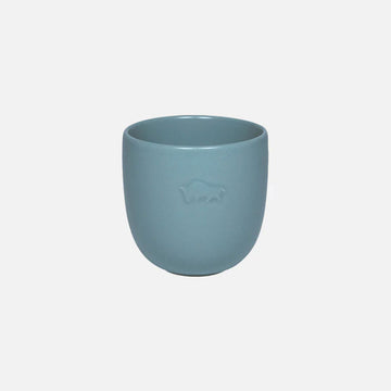 Blue ceramic cup with a logo on a white background.