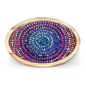 An oval shaped wooden tray printed with artwork by Olivia Wilson on the inside.