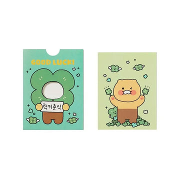 Card with a cartoon character holding a 'Good Luck!' sign on a light green background.
