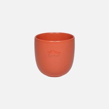 Ceramic mug in orange with a logo on a white background.