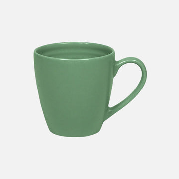 Green mug on a light gray background.