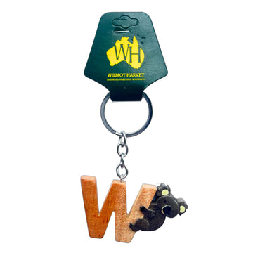 Keychain with wooden 'W' and koala charm on a Wilmot Harvey branded card.