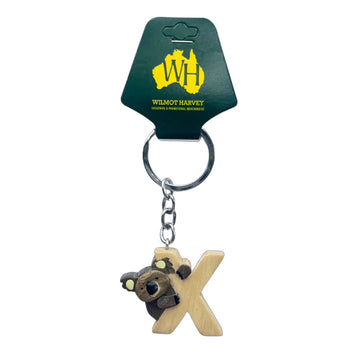 Keychain with koala design and wooden letter 'X' on a green card with Wilmot Harvey logo.
