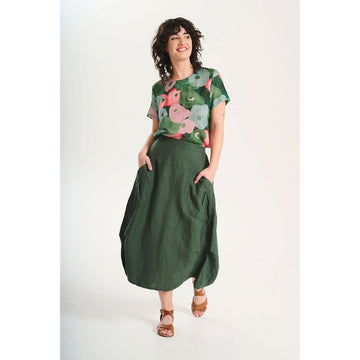 A skirt in sage green with side pockets.